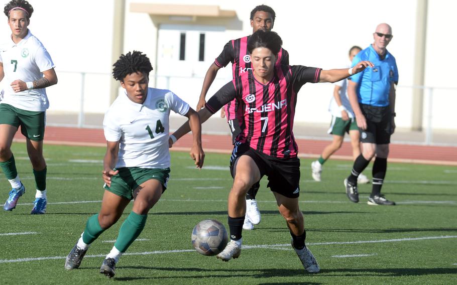 Kubasaki's Jyunia Darsan and Kadena's Frank Stare battle for the ball during Wednesday's DODEA-Okinawa boys soccer match. The Panthers won 8-0.