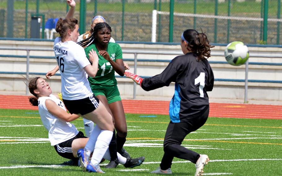 Naples’ Va Nae Filer watches her shot sail past Vicenza keeper Gia Barea towards the goal for the Wildcats’ in their 3-1 win over Vicenza in the Division II girls final at the DODEA-Europe championships at Ramstein, Germany, May 18, 2023.