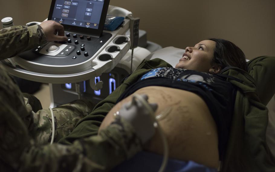 Air Force Staff Sgt. Nance Pea performs an ultrasound on an expectant mother at Misawa Air Base, Japan, April 10, 2019. Male and female airmen participating in a fertility treatment program are now authorized up to 35 days of permissive temporary duty, allowing military members to travel at no-cost to the government while conserving earned leave days. 