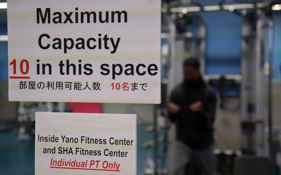 A sign alerts people to capacity restrictions inside a fitness center at Camp Zama, Japan, Feb. 3, 2022.