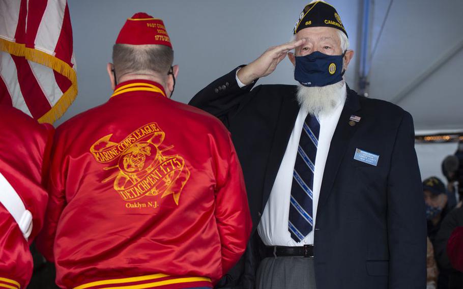 Tuesday, December 7, 2021 - Bernie Kofoet, right, a member of the American Legion FW Grigg Post #68 and the incoming Commander of Camden County Veterans Advisory Committee, salutes the flag during a Pearl Harbor Day Commemoration ceremony on board the Battleship New Jersey, Dec. 7, 2021. Kofoet was presented the Peter Molnar Award, presented yearly at the Pearl Harbor Ceremony to an individual who has been significantly involved with veterans activities in the  county and across the state.