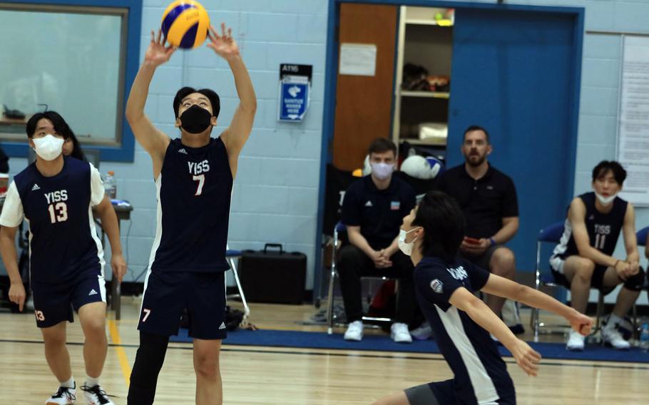 Yongsan’s Ashton Shim sets to teammate Andrew Shin against Osan during Wednesday’s Korea boys volleyball match. The Guardians won in three sets.