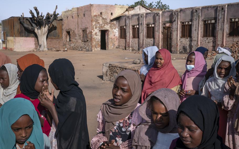 Children gather to start classes at the damaged Alkasim primary school in El Geneina. The school was the site of a camp for displaced people before it came under attack after the war broke out last April. In early January, 652 children resumed classes among the ruins. Because there are no school meals, classes end at noon, two hours earlier than they normally would.