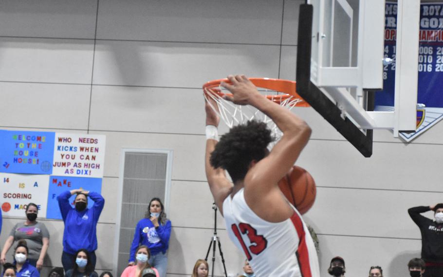 Kaiserslautern's Keenan Garner finishes his second dunk in as many nights, disappointing Ramstein fans in the championship game of the DODEA-Europe Division I boys basketball tournament on Saturday, Feb. 26, 2022. Royals fans were ultimately happy when their team won.