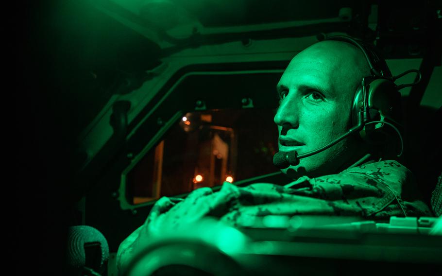 Marine Staff Sgt. Coltin Davenport, regimental communications chief, performs radio checks in a joint light tactical vehicle on Naval Support Activity Mid-South, Tenn., May 6, 2021. Marines in tactical vehicles and trucks drove from Camp Lejeune, N.C., to Twentynine Palms, Calif., in one of the longest convoys in Marine Corps history.