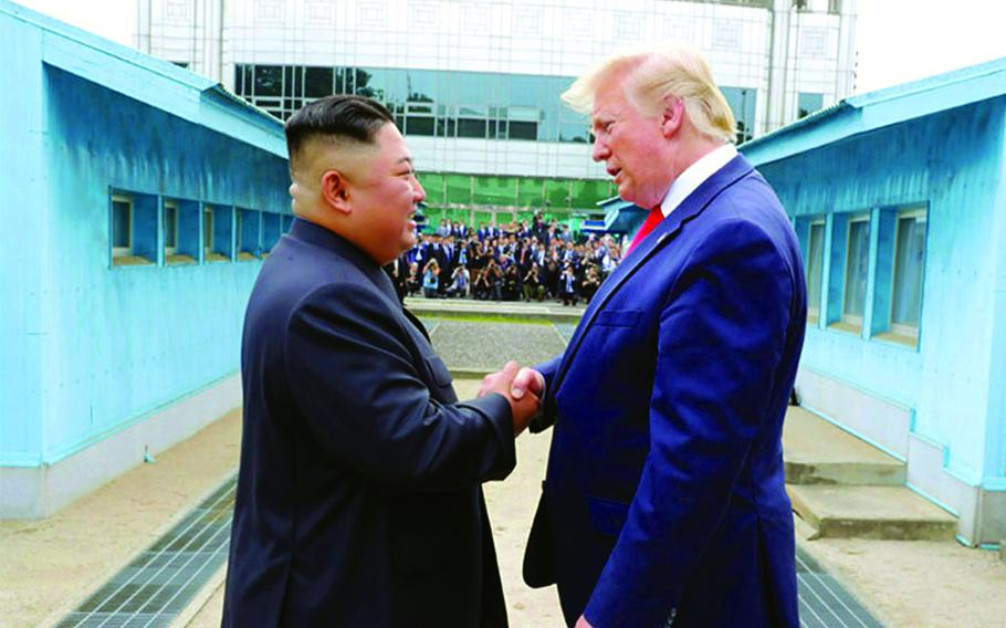 Then-President Donald Trump speaks with North Korean leader Kim Jong Un on the North Korean side of the Joint Security Area in the Demilitarized Zone, June 30, 2019.