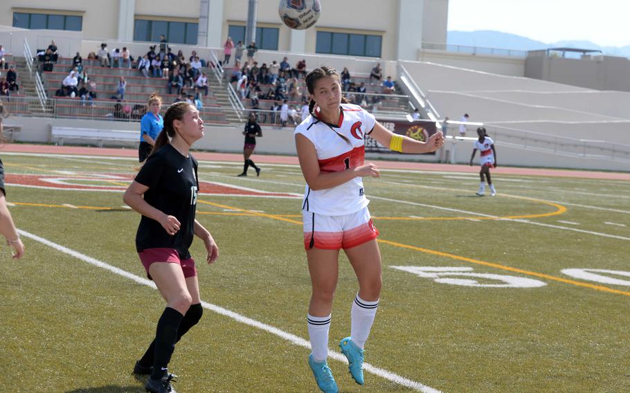 E.J. King's Maliwan Schinker heads the ball against Matthew C. Perry's Nevaeh Martinez during Friday's DODEA-Japan girls soccer match. The teams played to a scoreless draw.