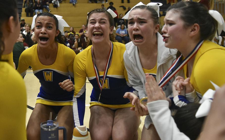 Wiesbaden cheerleaders react to hearing the team announced as the Division I champion during the 2024 DODEA-Europe Cheerleading Championships in Wiesbaden, Germany on Friday, Feb. 16, 2024. This was the third-consecutive cheerleading championship for Wiesbaden. 
