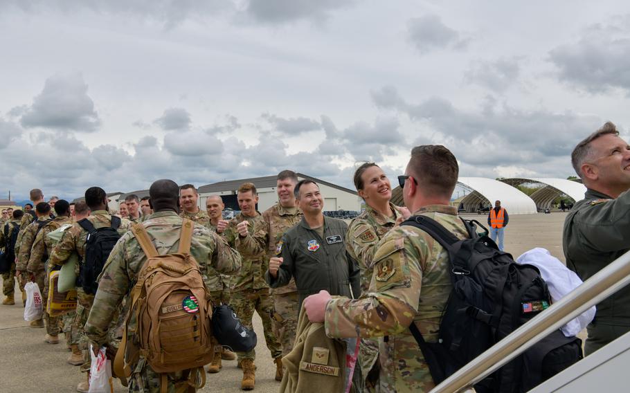 Airmen are greeted by friends and family