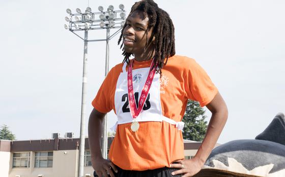 Marcus Trotter, of Nile C. Kinnick High School at Yokosuka Naval Base, poses with his gold medal for the 100-meter run at Yokota Air Base, Japan, Saturday, Nov. 4, 2023. The event was part of the 44th Kanto Plains Special Olympics.