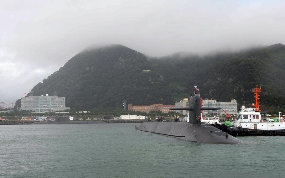 The Ohio-class ballistic missile submarine USS Kentucky pulls into Busan, South Korea, Tuesday, July 18, 2023.
