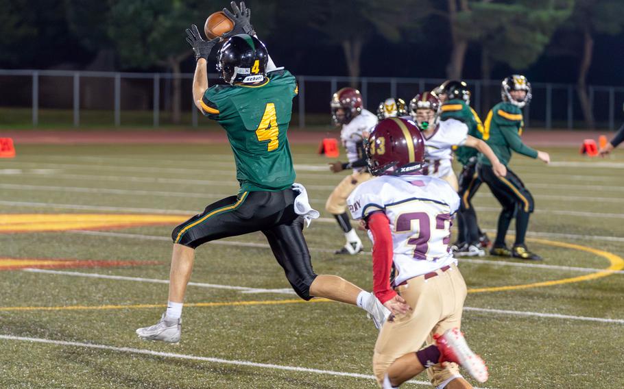 Robert D. Edgren's Parker Kuns snags a pass in front of Matthew C. Perry's Jacob Bradley.