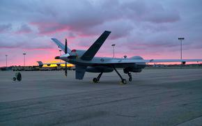 A remotely piloted MQ-9 Reaper from the 163rd Attack Wing sits in front of the 178th Wing hanger on Springfield-Beckley Air National Guard Base, Ohio, March 18, 2024. The aircraft is renowned for its broad capabilities in intelligence, surveillance, and reconnaissance missions. (U.S. Air National Guard photo by Staff Sgt. Jillian Maynus)