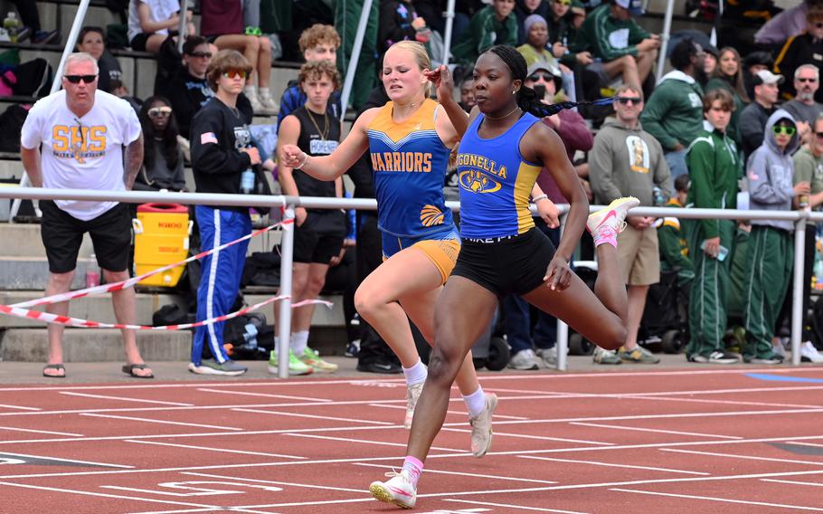 Sigonella’s Rickalia Goss beats Wiesbaden’s Lana Winters to the finish line in the girls 200-meter race at the 2025 DODEA-Europe track and field finals in Kaiserslautern, Germany. Goss won in 25.08 seconds ahead of 25.16 for Winters.