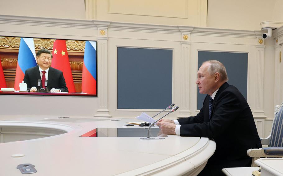In this file photo, Russian President Vladimir Putin holds a meeting with Chinese President Xi Jinping via a video link at the Kremlin in Moscow on December 30, 2022. Russian leader told his Chinese counterpart that he was keen to ramp up military cooperation and hailed the two countries' efforts to counter Western influence.