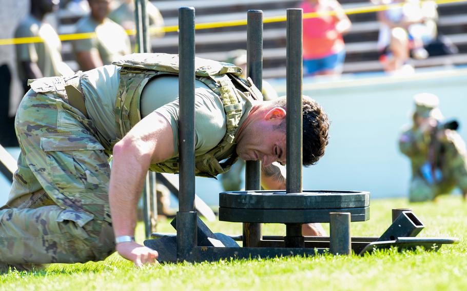 A soldier in the Army’s Best Ranger Competition pushes a 185-pound sled during the second day of the Best Ranger Competition, Saturday, April 15, 2023, atA.J. McClung Memorial Stadium in Columbus, Ga. 