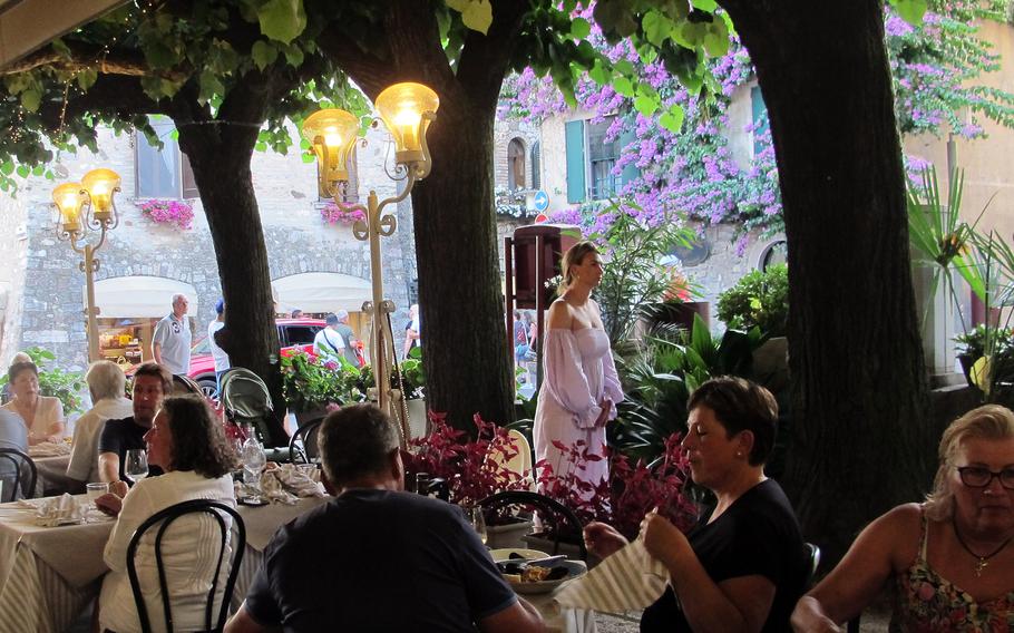 Ristorante San Lorenzo is in a prime spot in the center of Sirmione, across the cobblestones from the stone building covered in bougainvillea, where many people pose for photos.  