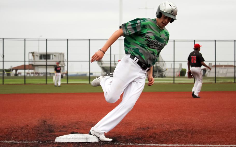 Kubasaki's Jacy Fisk rounds third and heads home against Kinnick.