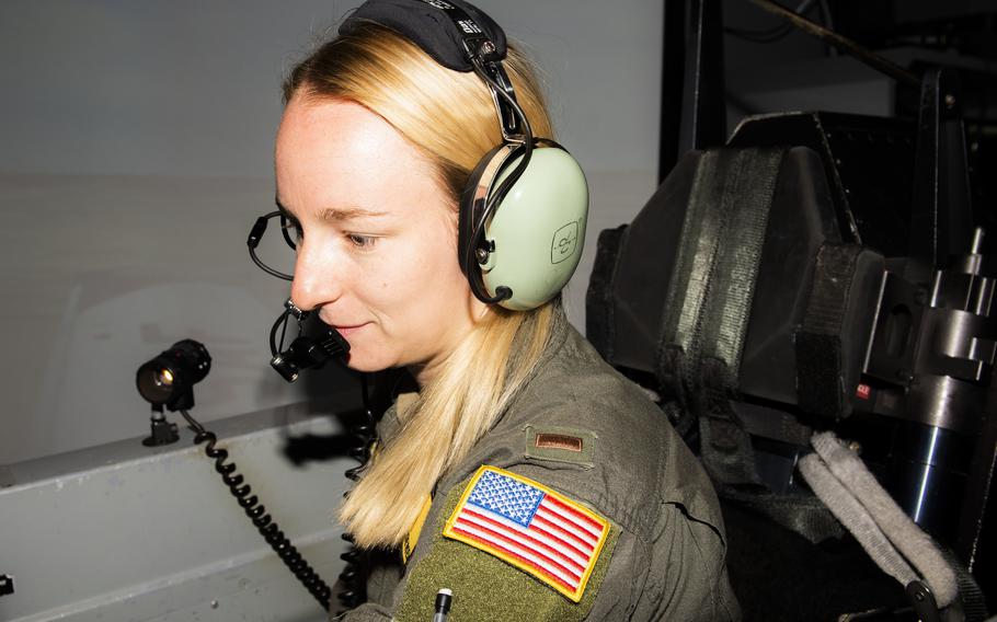2nd Lt. Mackenzie Loewen, 47th Flying Training Wing student pilot, straps into her seat and prepares for a simulated Texan II T-6 flight at Laughlin Air Force Base, Texas, on July 19, 2021. The simulators are state-of-the-art equipment that can replicate any environment or situation that they may face when piloting the aircraft.