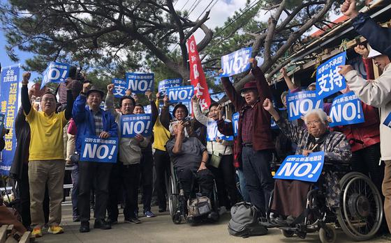 Protesters gathered outside Camp Schwab, Okinawa, Friday, Jan. 12, 2024, following the restart of construction for a runway being built into Oura Bay. 