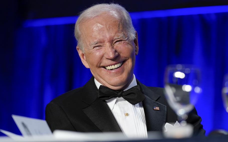 President Joe Biden laughs as he listens to Trevor Noah, host of Comedy Central’s “The Daily Show,” speak at the annual White House Correspondents’ Association dinner, Saturday, April 30, 2022, in Washington. 