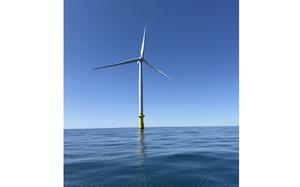 An offshore windmill in the sea.