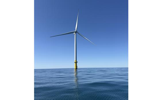 An offshore windmill in the sea.