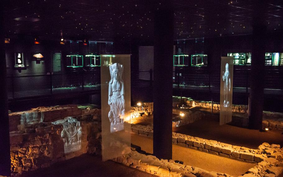 Images of statues of Isis and Mater Magna are projected over the remnants of a Roman temple in Mainz, Germany, where they once may have stood. The small museum preserves some of the walls and artifacts found during construction in the early 2000s.
