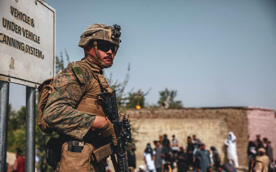 A Marine with the 24th Marine Expeditionary Unit provides security during an evacuation at Hamid Karzai International Airport, Kabul, Afghanistan, Aug. 18, 2021. 