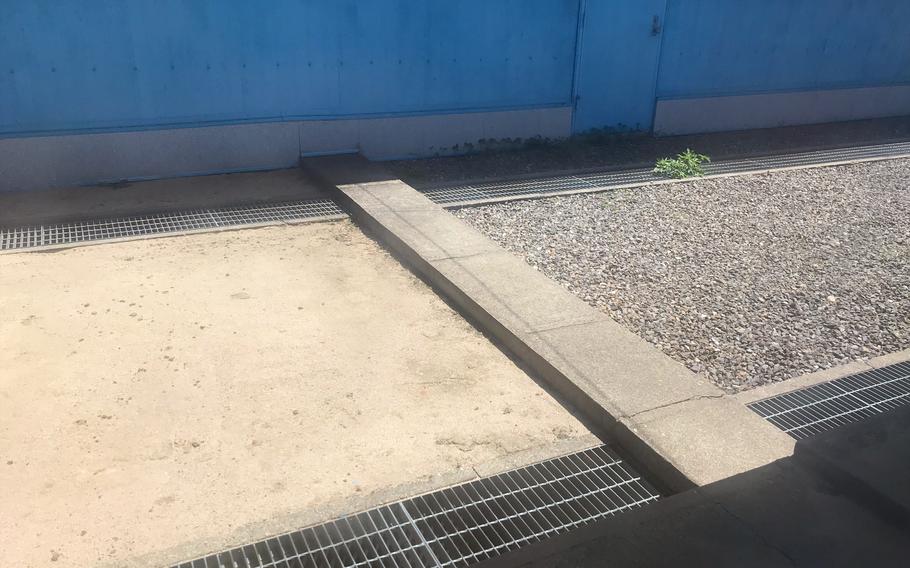 A concrete slab marking the Military Demarcation Line is pictured from the North Korean side of the Joint Security Area, May 29, 2019.