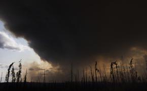 Black smoke fills the sky.