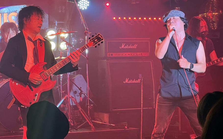 JP/DC, an AC/DC tribute band, performs “You Shook Me All Night Long” at Bauhaus in Tokyo’s Roppongi district, July 24, 2022. 
