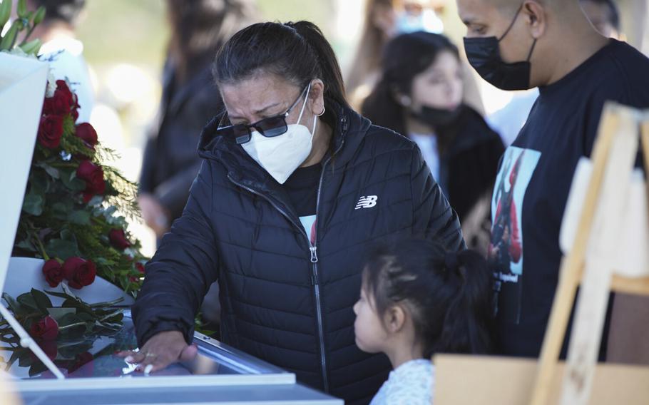 Coverage of Tijuana photojournalist Margarito Martinez Esquivel’s funeral. Elena Frausto, wife of Margarito, says goodbye before the casket is laid to rest at Cemetery Santa Gema on Jan. 21, 2022, in Tijuana, Baja California. 