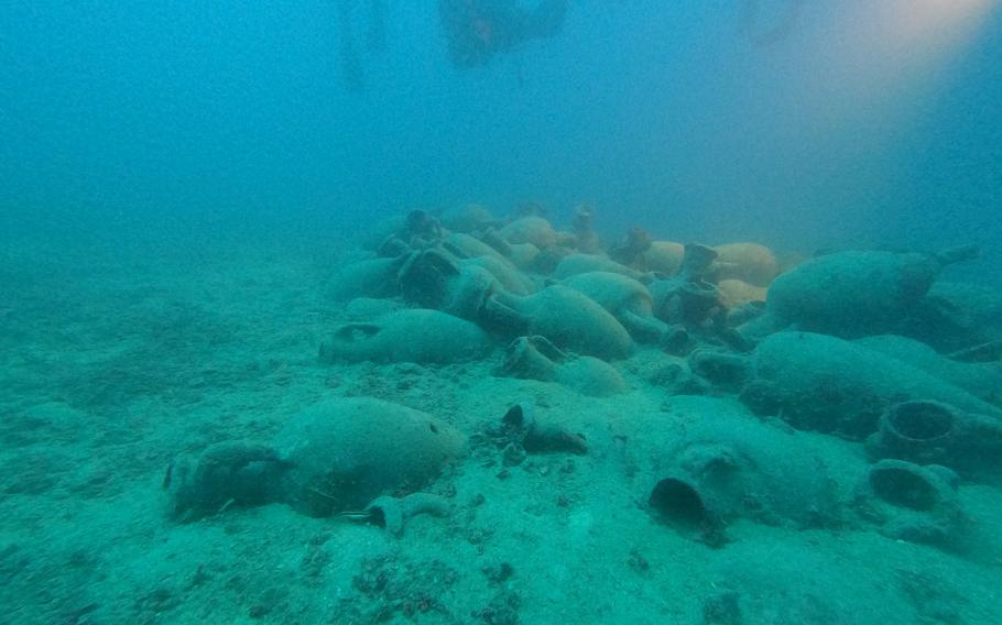 The sunken ship was still loaded with ancient Roman pottery dating to the 3rd century B.C., archaeologists said. Photos show the pile of artifacts on the seafloor.