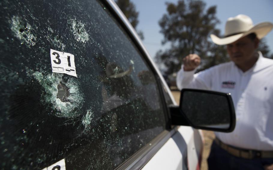 Mayoral candidate Guillermo Valencia shows in Morelia, Michoacan state, Mexico, on May 22, 2021, the bullet-riddled vehicle he was driving when armed men attacked. Gunmen near the town of Tepalcatepec, Michoacan, wounded two members of the Mexican National Guard according to reports on Wednesday, Sept. 15.