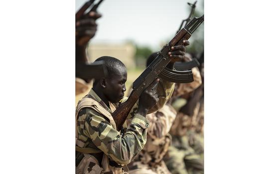 Chadian Special Anti-Terrorism Group trainees practice battlefield maneuvers of advance and retreating on a position during a border patrol exercise led by the U.S. Regionally Aligned Force (RAF) from Fort Stewart, Georgia, July 30, 2019. The U.S. continues to support its African partners in maintaining stability in the region and protecting against threats to their citizens and sovereignty. (U.S. Navy photo by Mass Communication Specialist Second Class Evan Parker)