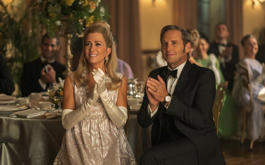 Kristen Wiig and Josh Lucas in a scene from the series “Palm Royale.” Wiig plays Palm Royale high society wannabe Maxine Simmons. Lucas plays Maxine’s husband. 