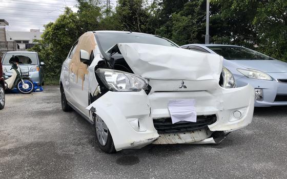 A Mitsubishi Mirage involved in a wrong-way crash in Uruma city sits at the Naha Police Station, Tuesday, Jan. 17, 2023. 