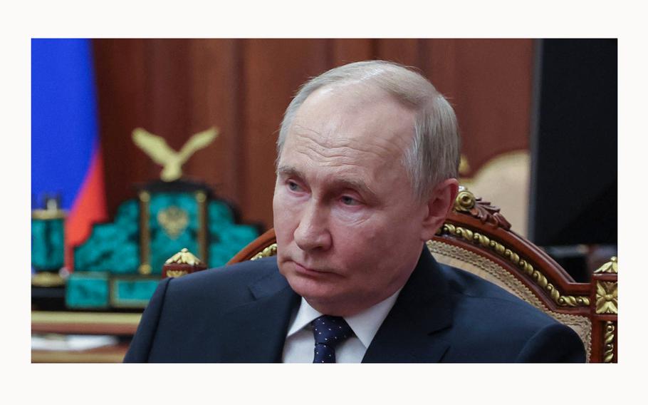 In this pool photograph distributed by Russian state agency Sputnik, Russia President Vladimir Putin attends a meeting in Moscow on June 1, 2024.