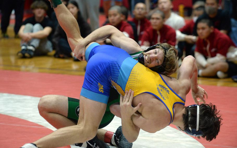 Kubasaki's 172-pounder Kaiser Armour tosses St. Mary's International's Roman Leyko en route to a win by pin in 4 minutes, 53 seconds in the weight-class final.