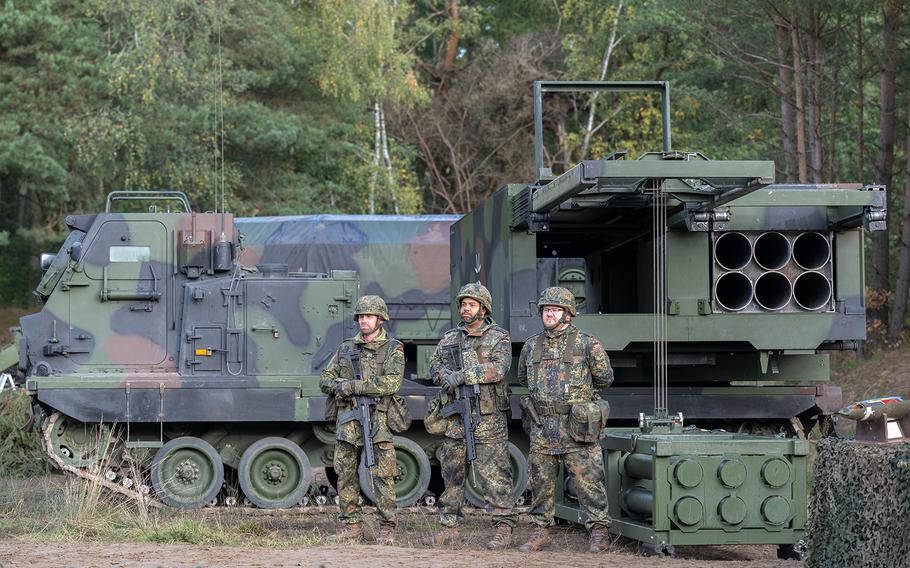 The crew of a rocket launcher Mars 2 with its munitions waiting for Chancellor Olaf Scholz during a visit at the Bundeswehr army training center in Ostenholz on Oct. 17, 2022, near Hodenhagen, Germany. 