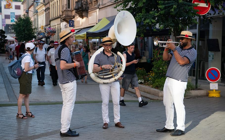 A brass band plays on a street in Sarreguemines, France.