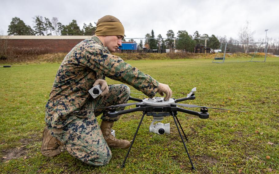 U.S. Marine Lance Cpl. Philip McLaughlin changes batteries on an R80D Skyraider during a test flight in Dragsvik, Finland, Nov. 13, 2023. McLaughlin is a motor vehicle operator assigned to Combat logistics Battalion 6, Combat Logistics Regiment 2, 2nd Marine Logistics Group. 