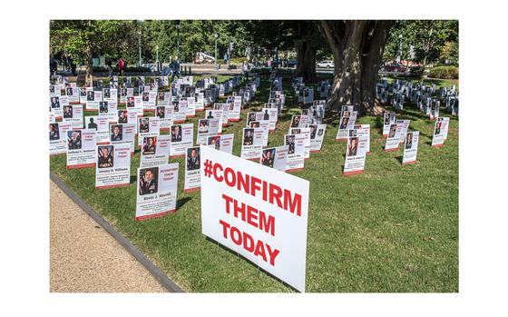 A display outside the U.S. Capitol in Washington on Tuesday, Sept. 19, 2023, shows placards with information on military officers whose promotions have been held up as Sen. Tommy Tuberville, R-Ala., is demanding that the Pentagon change a policy on abortion berore the officer promotions can be approved.