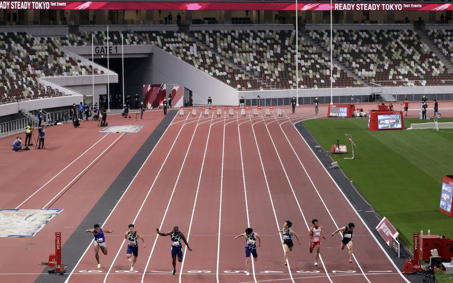 Athletes compete during an Olympics test event at the National Stadium in Tokyo on May 9.