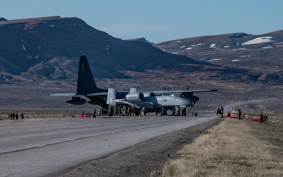 An MC-130J Commando II offloads fuel to an A-10 Thunderbolt II on state Route 287 near Rawlins, Wyo., on April 30, 2023. By using the public highway as a forward arming and refueling point, crews showed they can extend their reach beyond normal airfields.