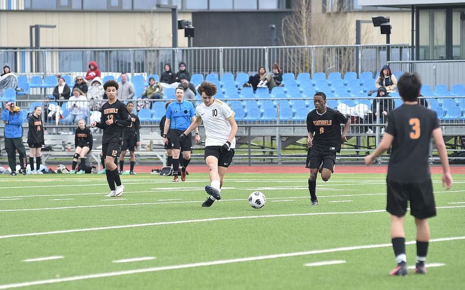 Alconbury midfielder Leo Politis passes during a March 16, 2024, game against the Sentinels at Spangdahlem High School in Spangdahlem, Germany.