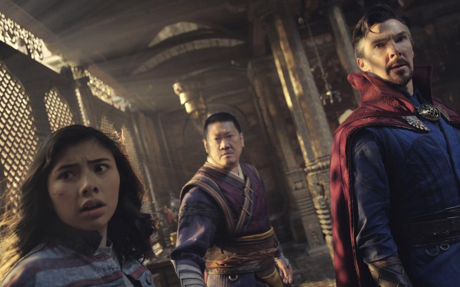 From left: Xochitl Gomez as America Chavez, Benedict Wong as Wong and Benedict Cumberbatch as Dr. Stephen Strange face various versions of reality in “Doctor Strange in the Multiverse of Madness.” 