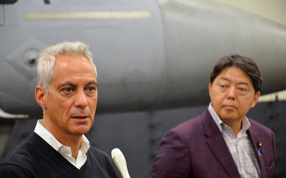 U.S. Ambassador to Japan Rahm Emanuel speaks with reporters alongside Japanese Foreign Minister Yoshimasa Hayashi aboard the aircraft carrier USS Abraham Lincoln in the Philippine Sea, Saturday, April 23, 2022. 