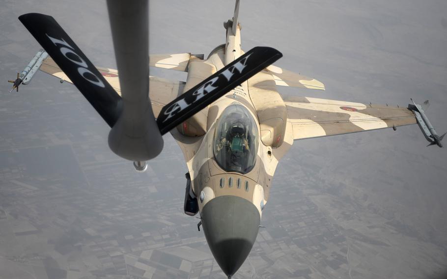 After refueling, a Moroccan air force F-16 Fighting Falcon departs from a U.S. Air Force KC-135 tanker from the 100th Air Refueling Wing during Exercise African Lion in June 2021. The U.S. Air Force needs to focus more on North Africa, particularly as Russia seeks to grow its influence in Libya, a Rand Corp. report said.